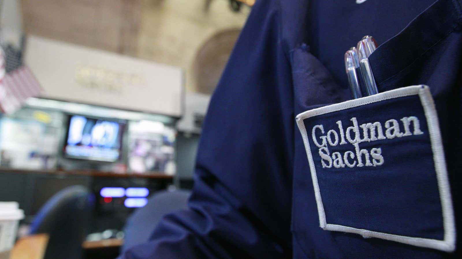 A trader works at the Goldman Sachs stall on the floor of the New York Stock Exchange, April 16, 2012.