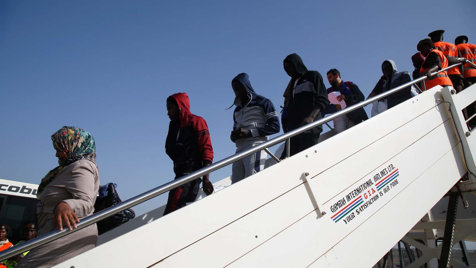 Deported Gambian migrants arrive at the airport in Banjul, Gambia in 2017.