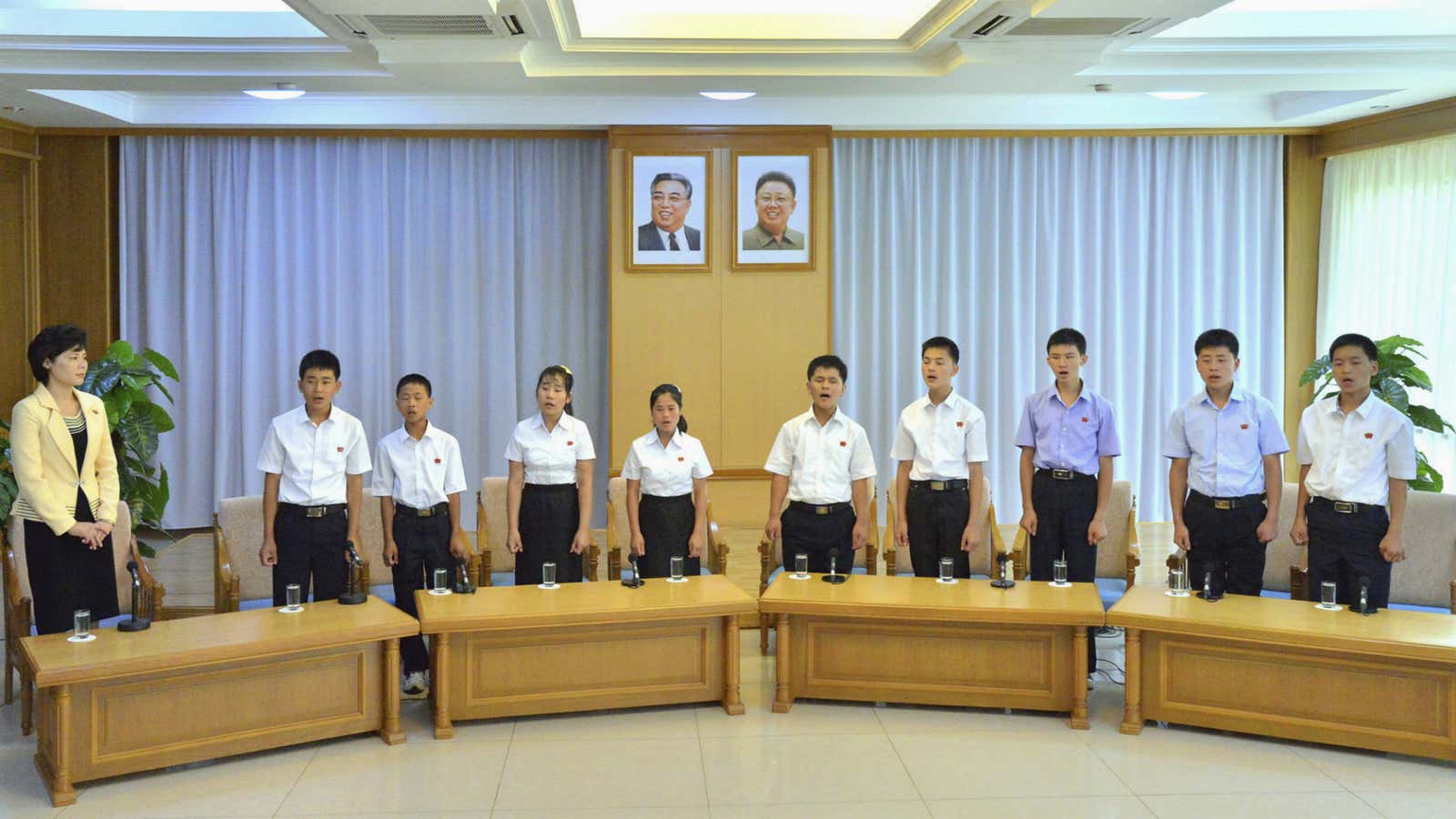 Nine young North Korean defectors returned by Laos sing about their loyalty to Kim Jong-un.