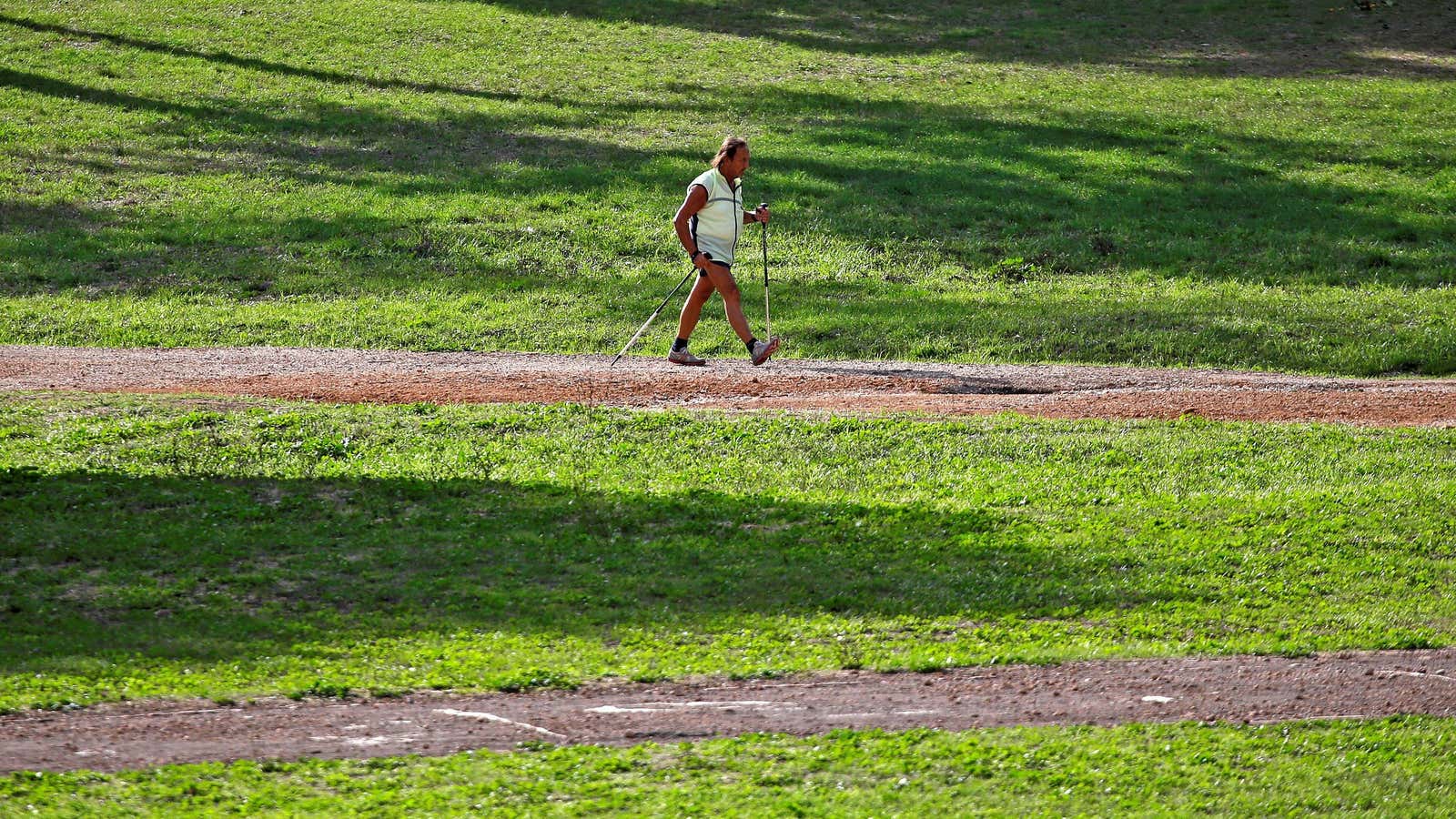 A man practices nordic walking in a public park in Rome, Italy, September 19, 2017.