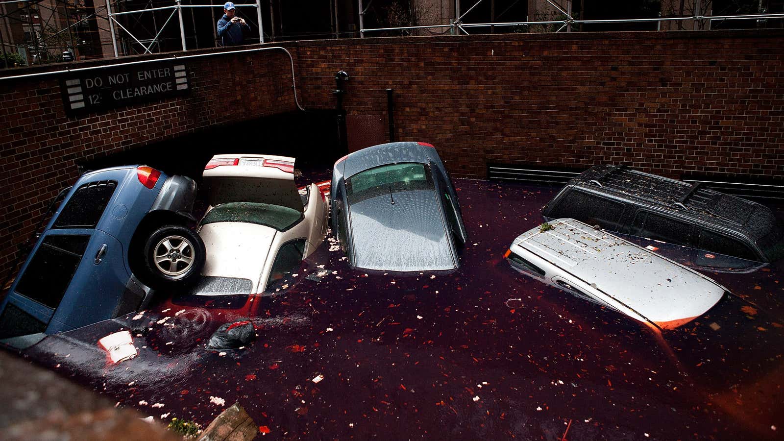 Cars floating in an underground parking basement in New York City’s financial district.