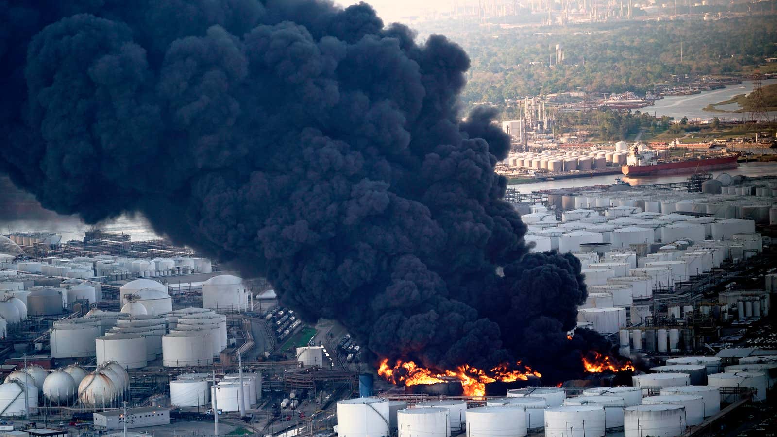 A plume of smoke rises from the petrochemical fire at the Intercontinental Terminals Company.