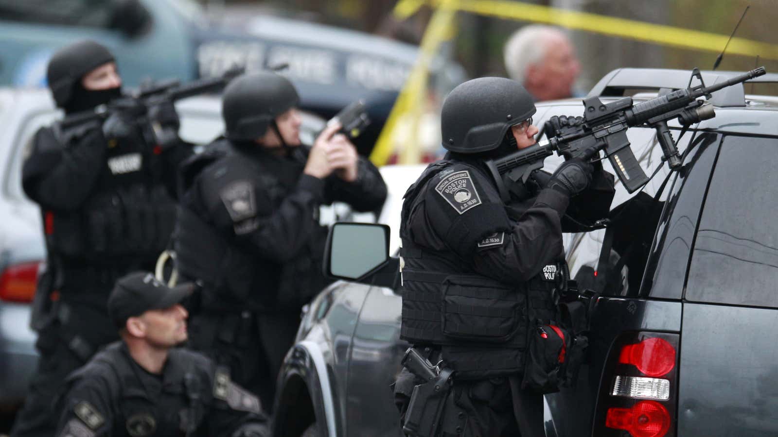 Police surround an apartment building in Watertown, MA, as the search for Dzhokhar Tsarnaev continues.