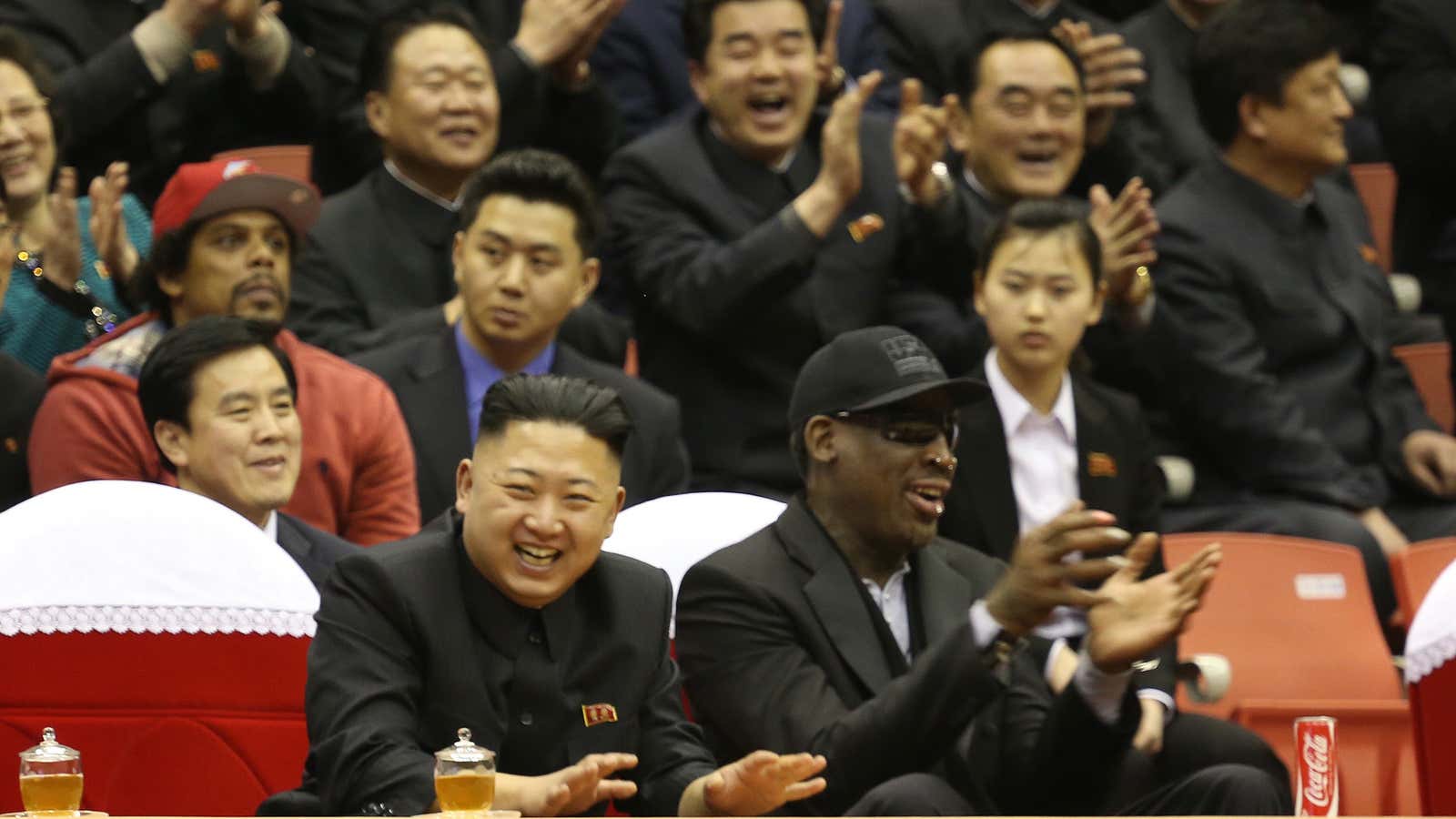 Little Kim hangs courtside with Dennis Rodman, who is a shade under two meters tall.