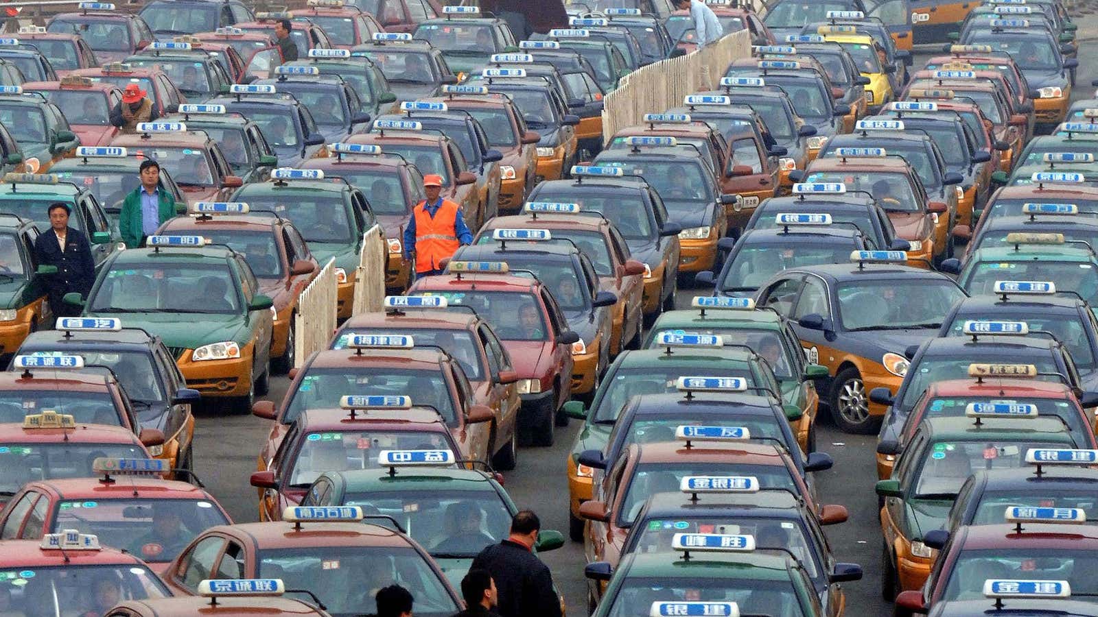 Taxis wait for customers at the Beijing Railway Station in Beijing.