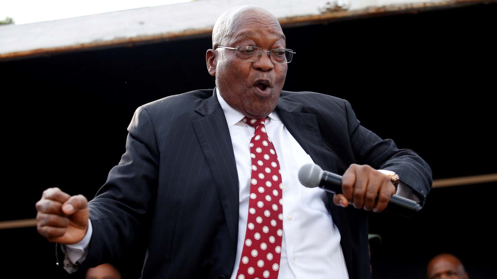 Former president Jacob Zuma dances as he addresses supporters outside court in Durban, South Africa, June 8, 2018.