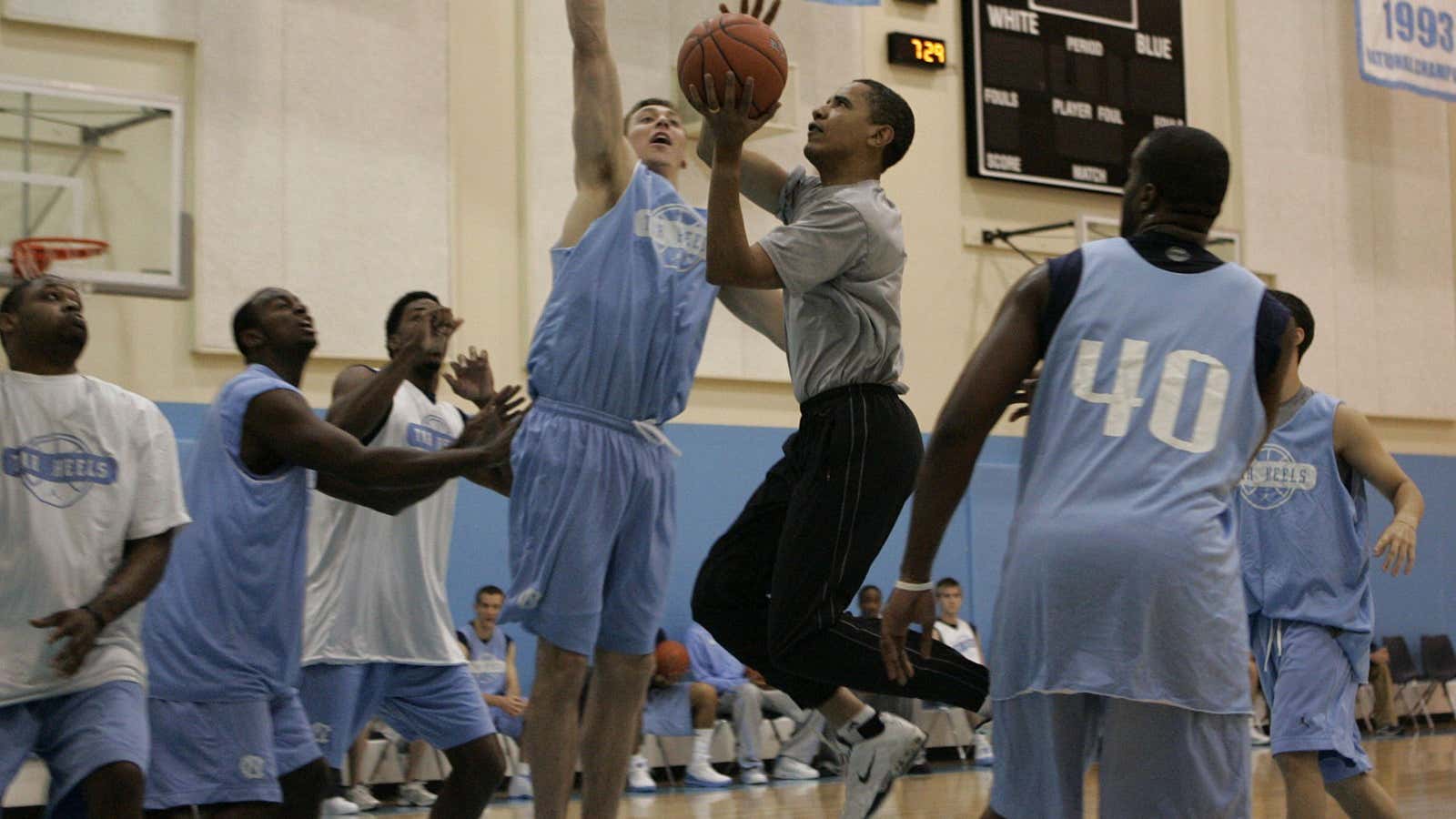 Obama driving to the basket in traffic.