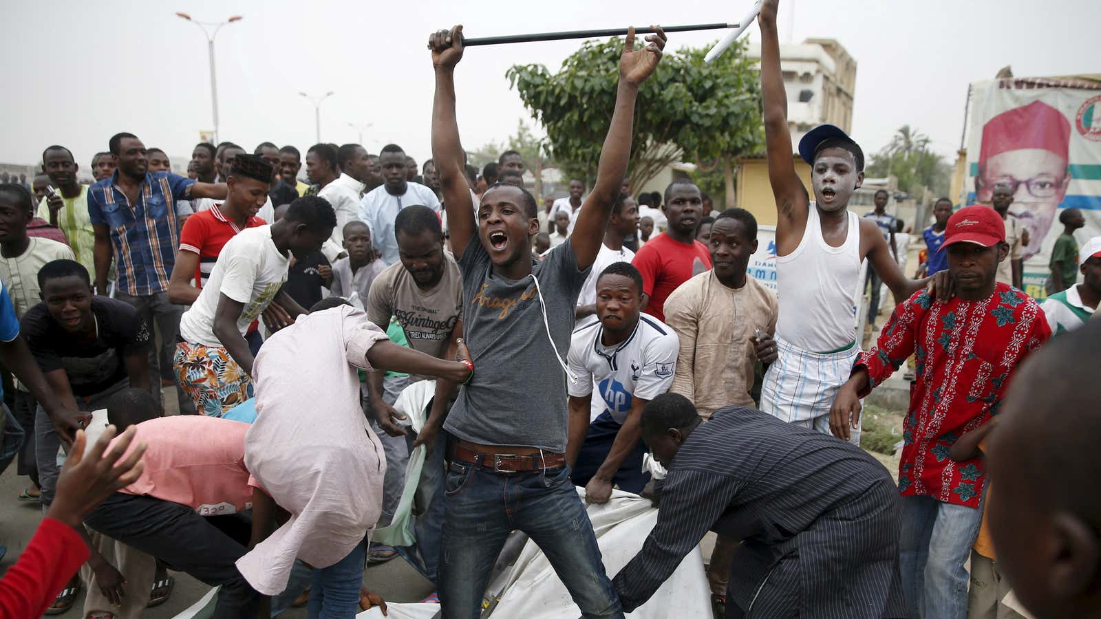 Supporters of the presidential candidate Muhammadu Buhari and his All Progressive Congress (APC) party celebrate in Kano March 31, 2015