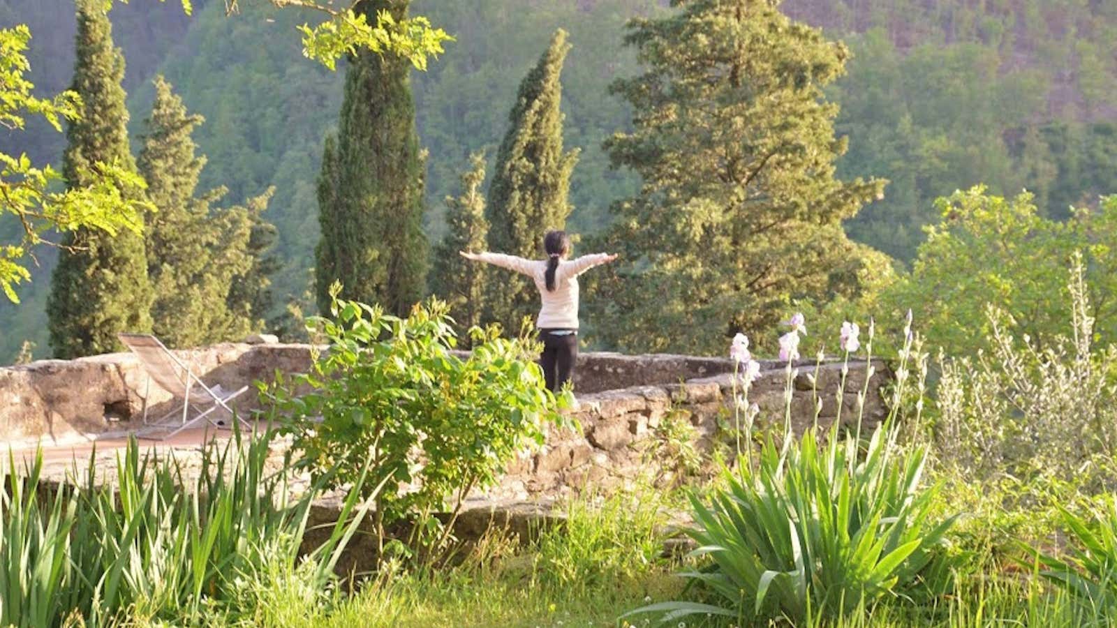 A woman practices yoga at the retreat center.