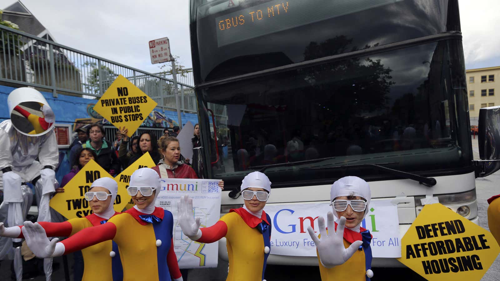 Demonstrators block the path of a Google commuter bus to Mountain View, in San Francisco.