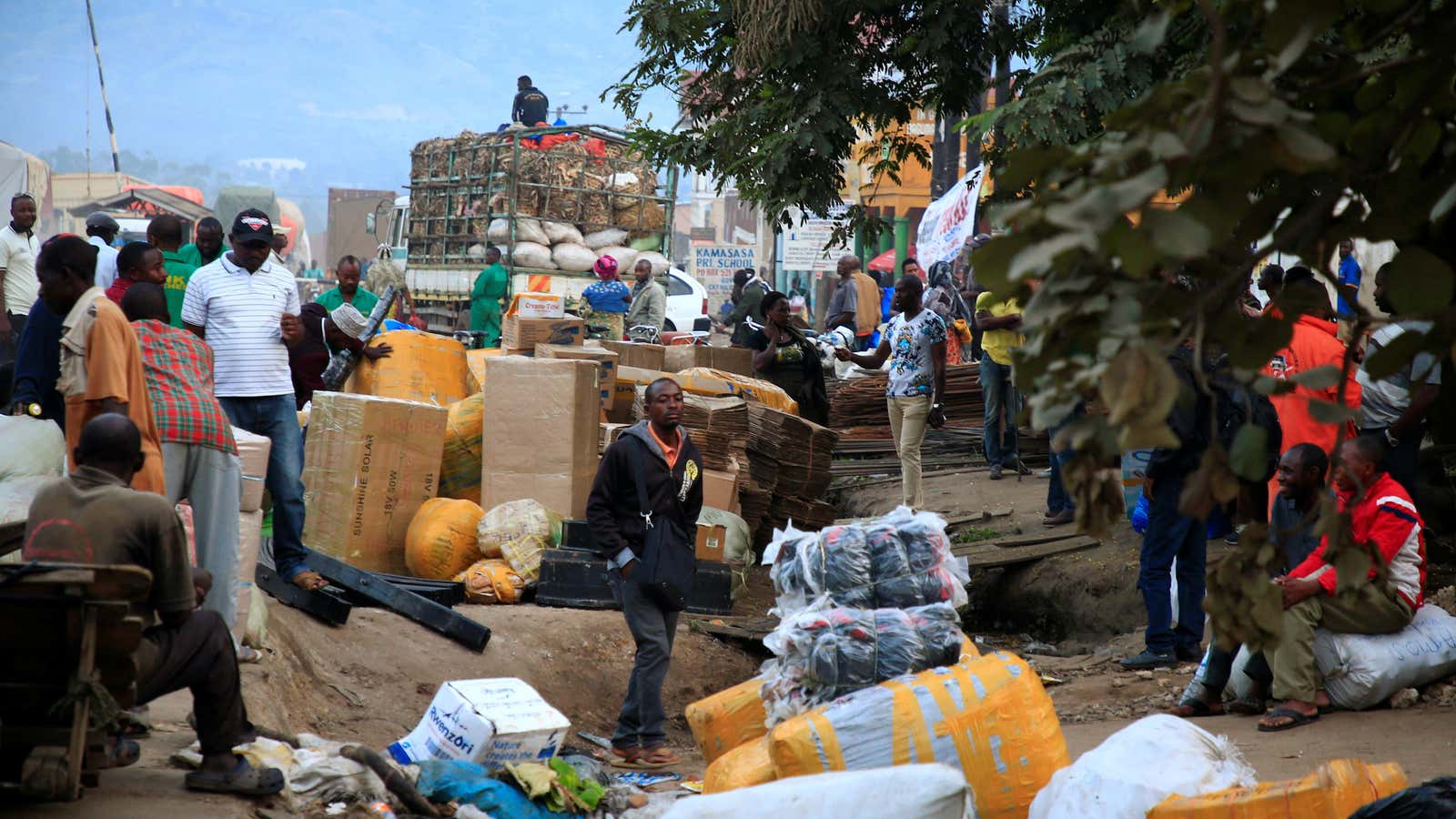 Ugandan business people are seen at a market with their merchandises for sale at Mpondwe border that separates Uganda and the Democratic Republic of Congo, June 14, 2019.