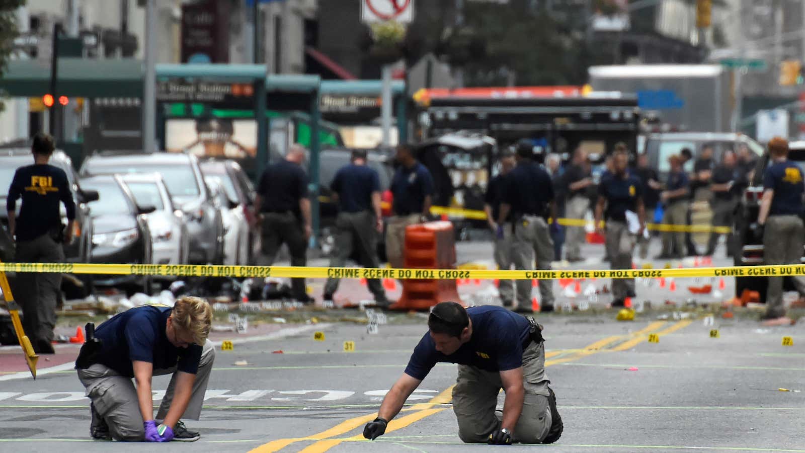 Federal Bureau of Investigation (FBI) officials mark the ground near the site of an explosion in the Chelsea neighborhood of Manhattan, New York, U.S. September…