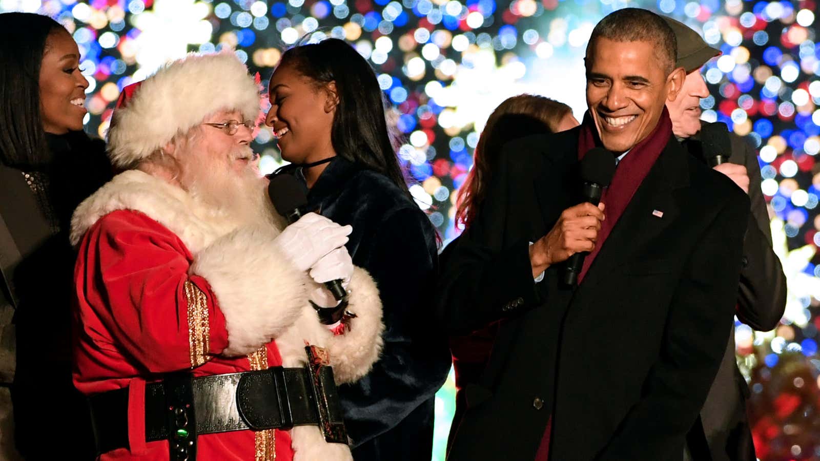 “Santa, what the hell are we singing?” “Just keep smiling, Barack.”