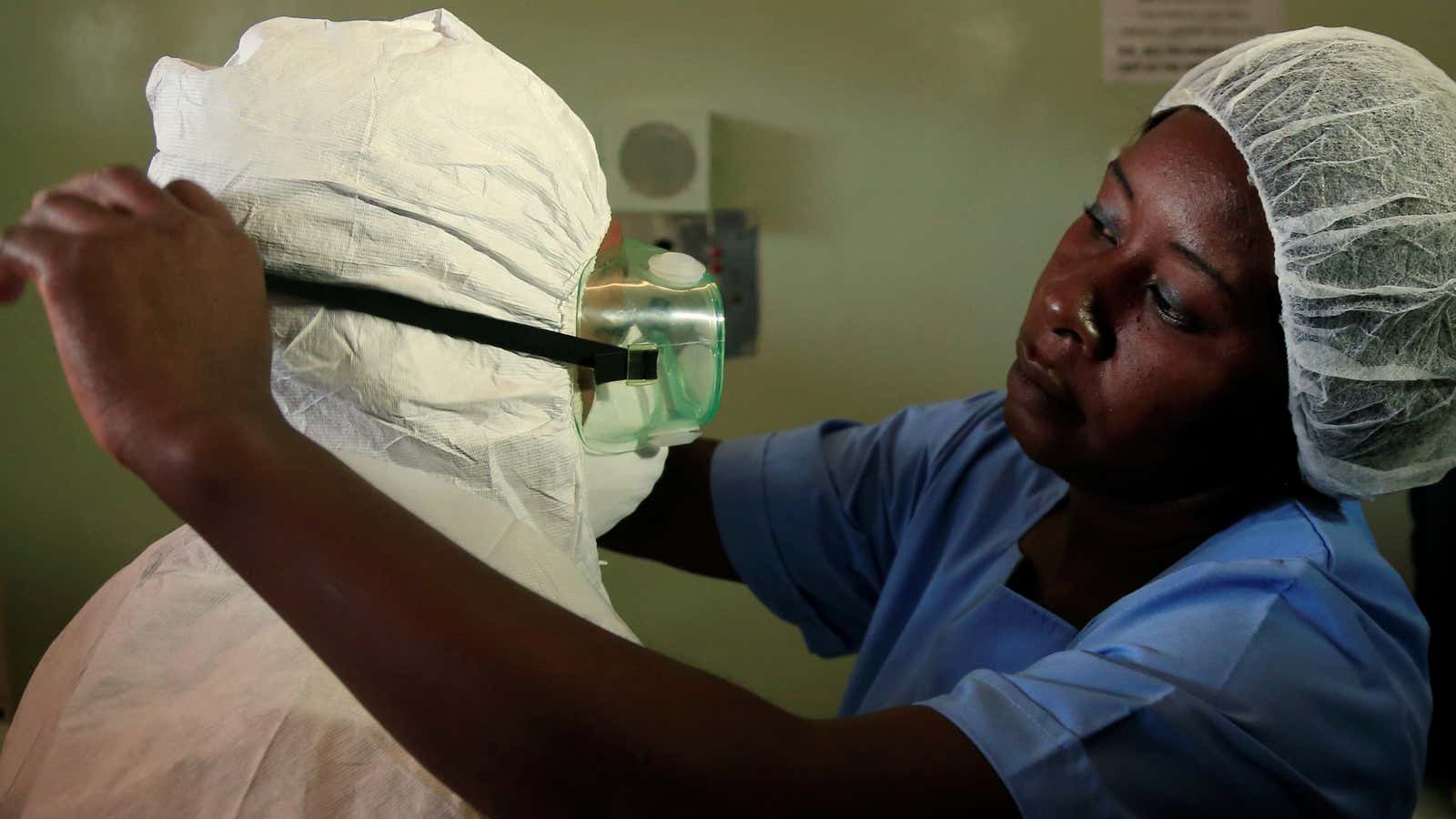 A health worker wears a protective suit during a demonstration of preparations for any potential coronavirus cases at a hospital in Harare, Zimbabwe, Mar. 5, 2020.