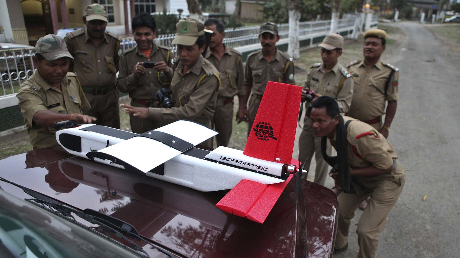 What’s so scary? Indian forestry officials inspect a surveillance drone in a national park.