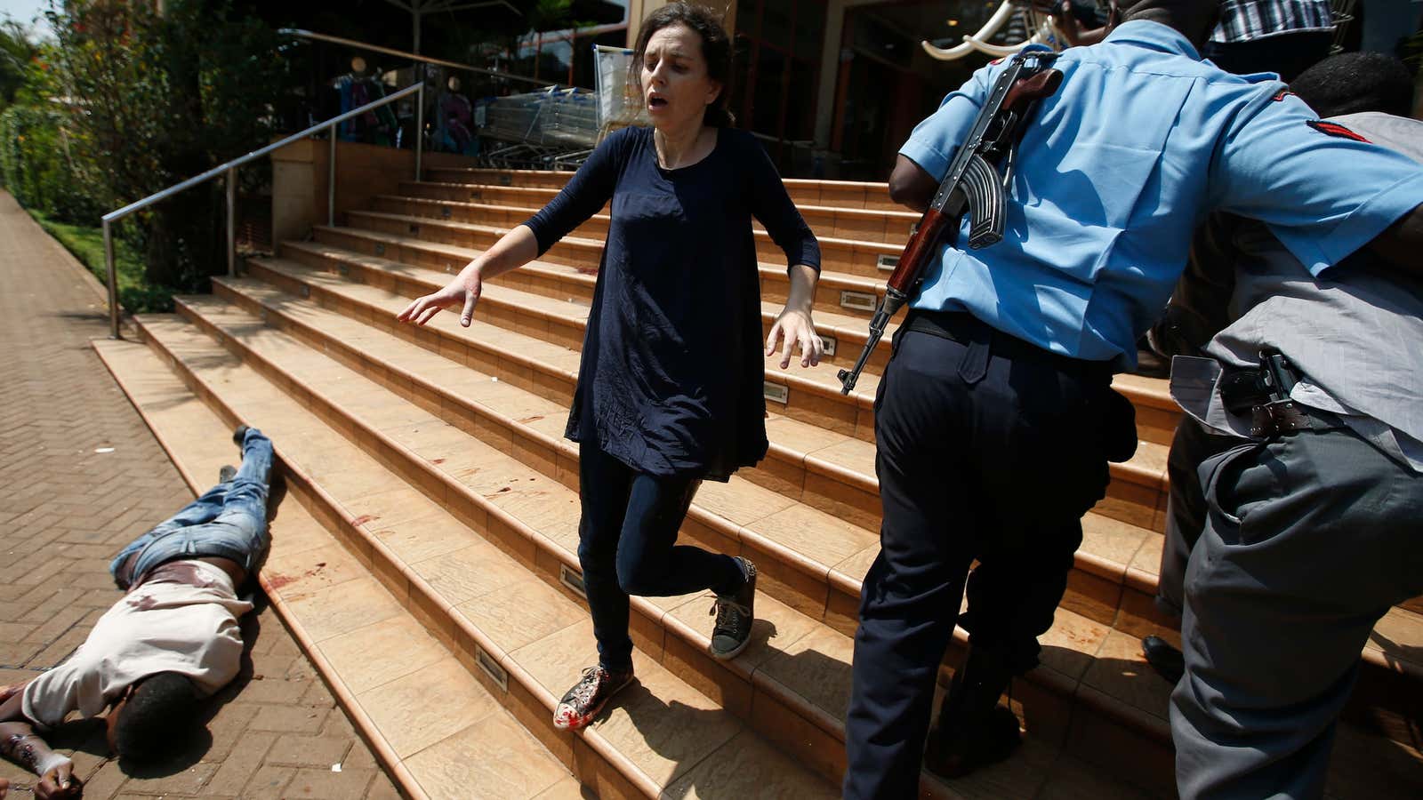 A survivor of the shooting leaves the Westgate mall on Sept. 21.