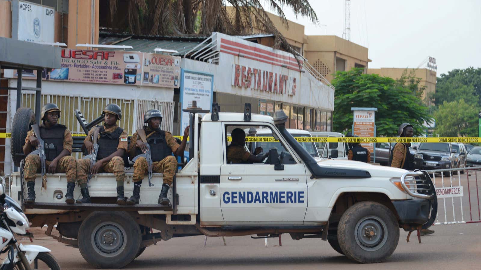 Security forces after the overnight raid on a restaurant in Ouagadougou, Burkina Faso