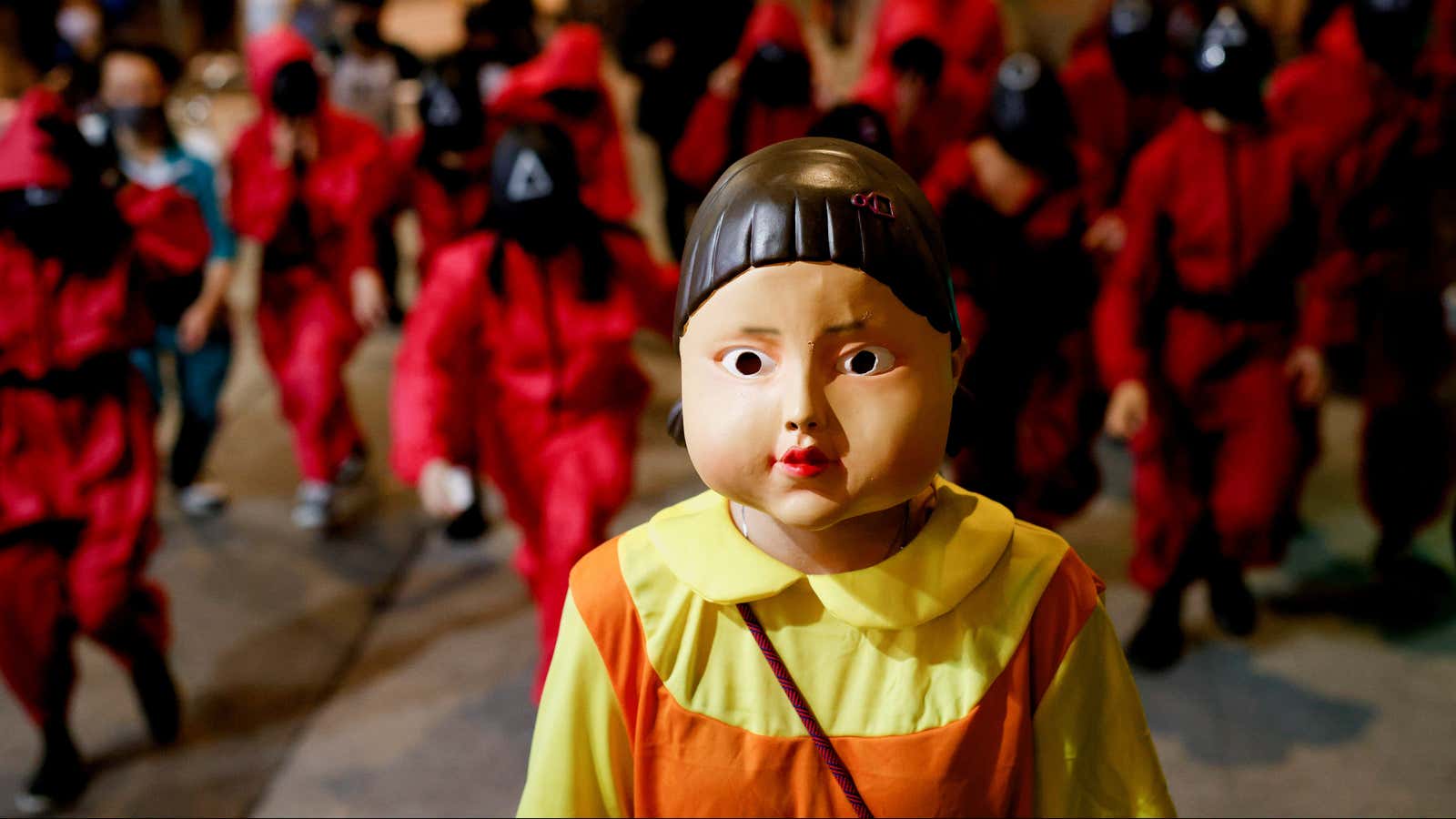 People wear Netflix series ‘Squid Game’ costumes celebrating Halloween, in Hong Kong, China, October 31, 2021. REUTERS/Tyrone Siu