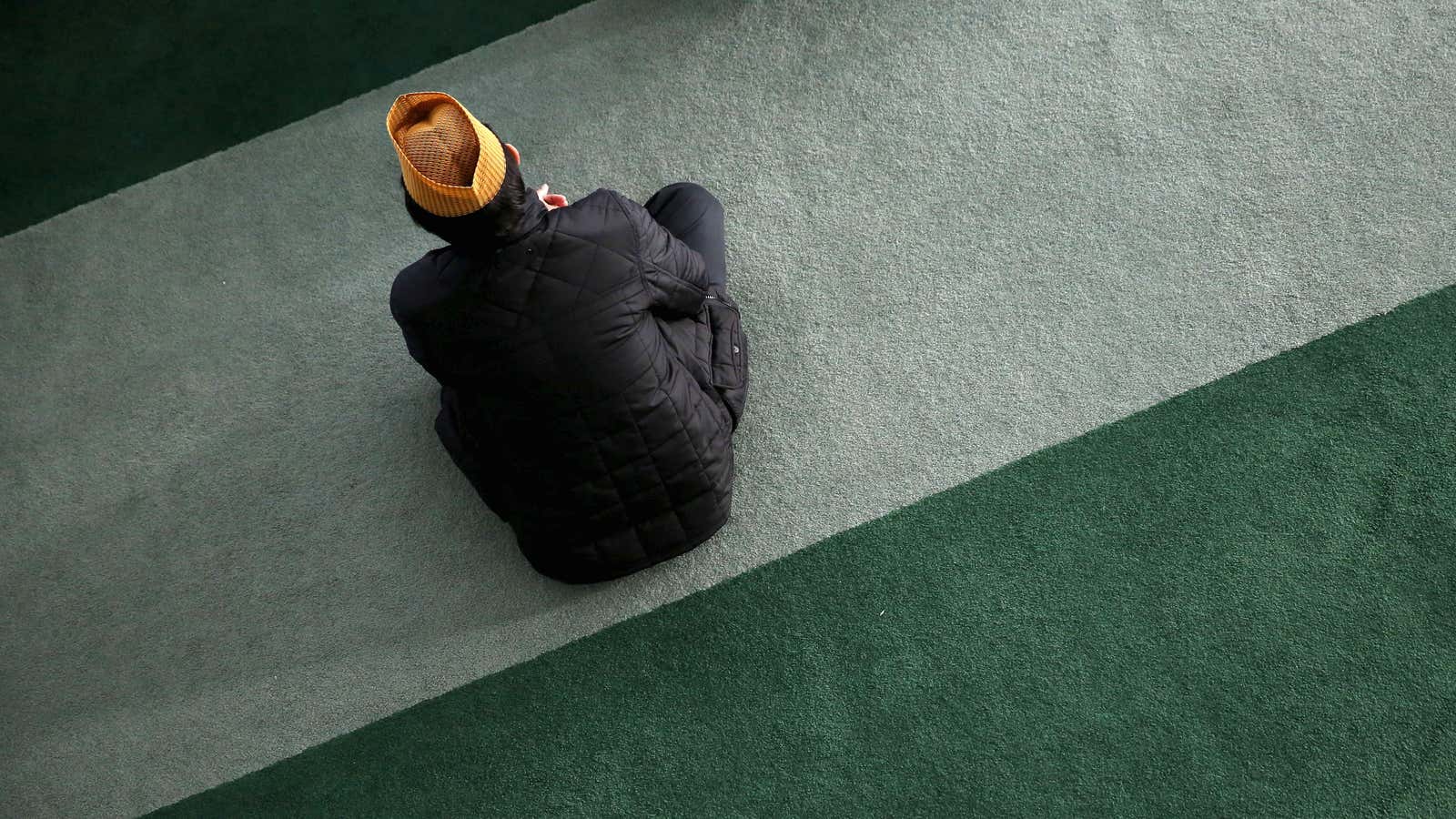 A Muslim attends Friday prayer in London.