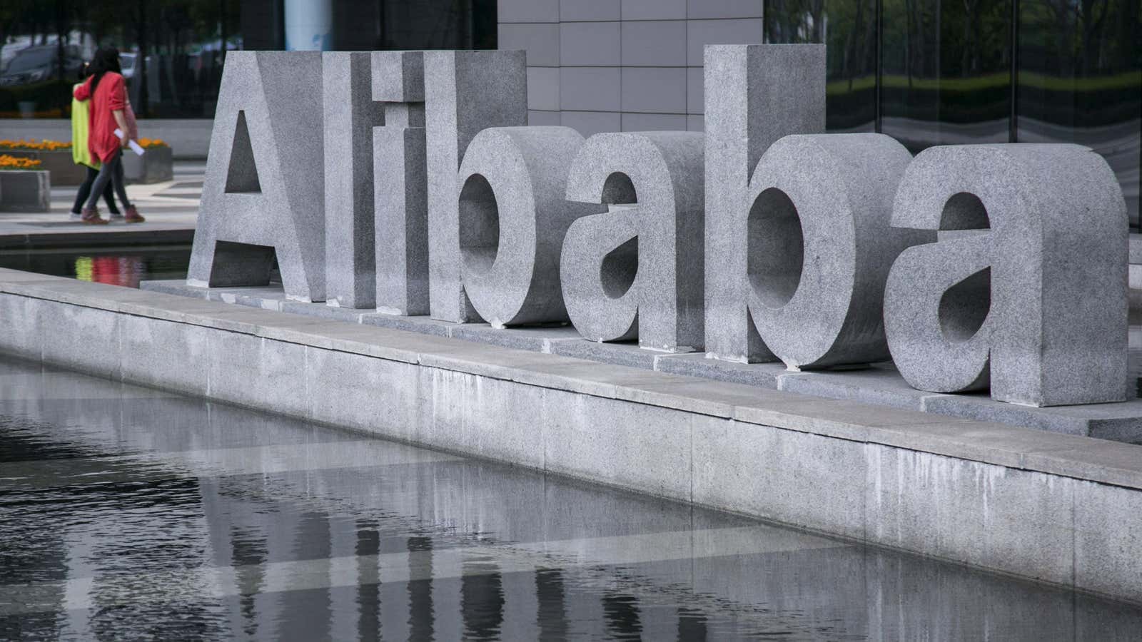 People walk at the headquarters of Alibaba in Hangzhou, Zhejiang province, April 23, 2014. A