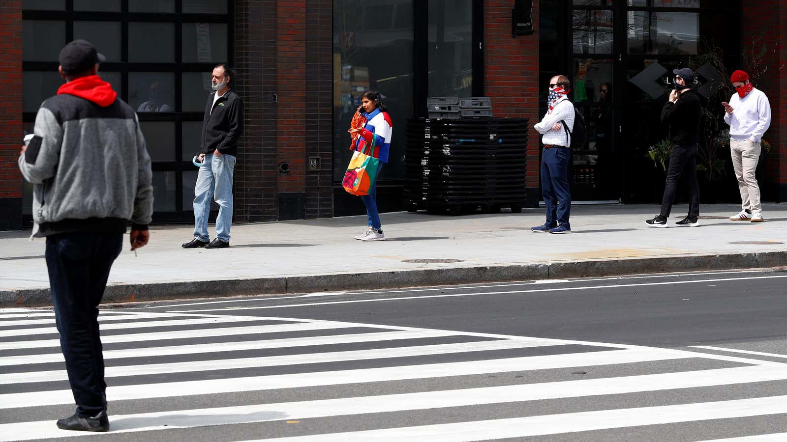 People wait in a socially distanced line in Washington, DC.