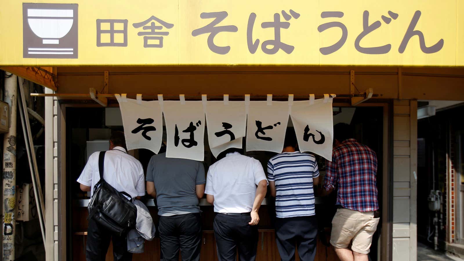 Slurping soba and udon at a stand-up noodle shop.