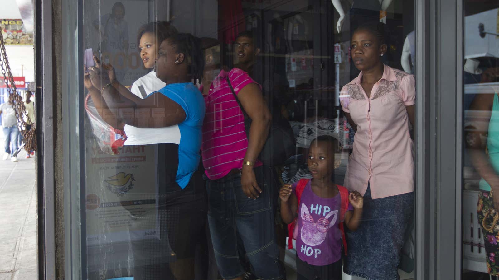 Shopkeepers in Durban look as police quell xenophobic unrest.