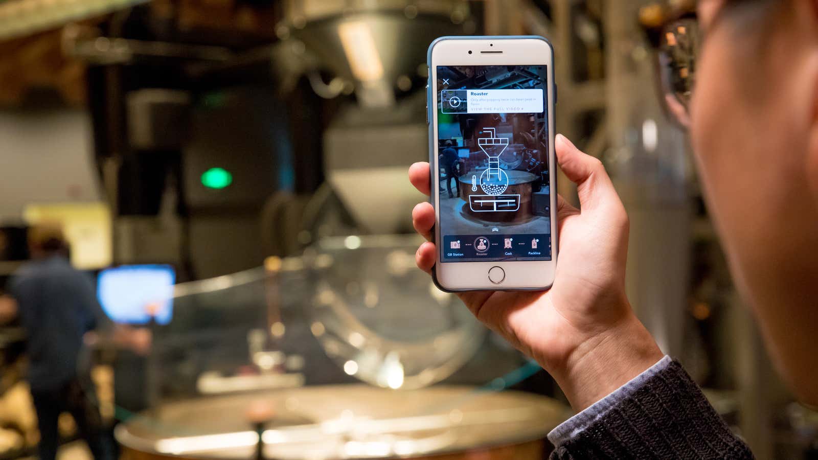 An augmented reality app is used in the new Starbucks Roastery in Shanghai, China.