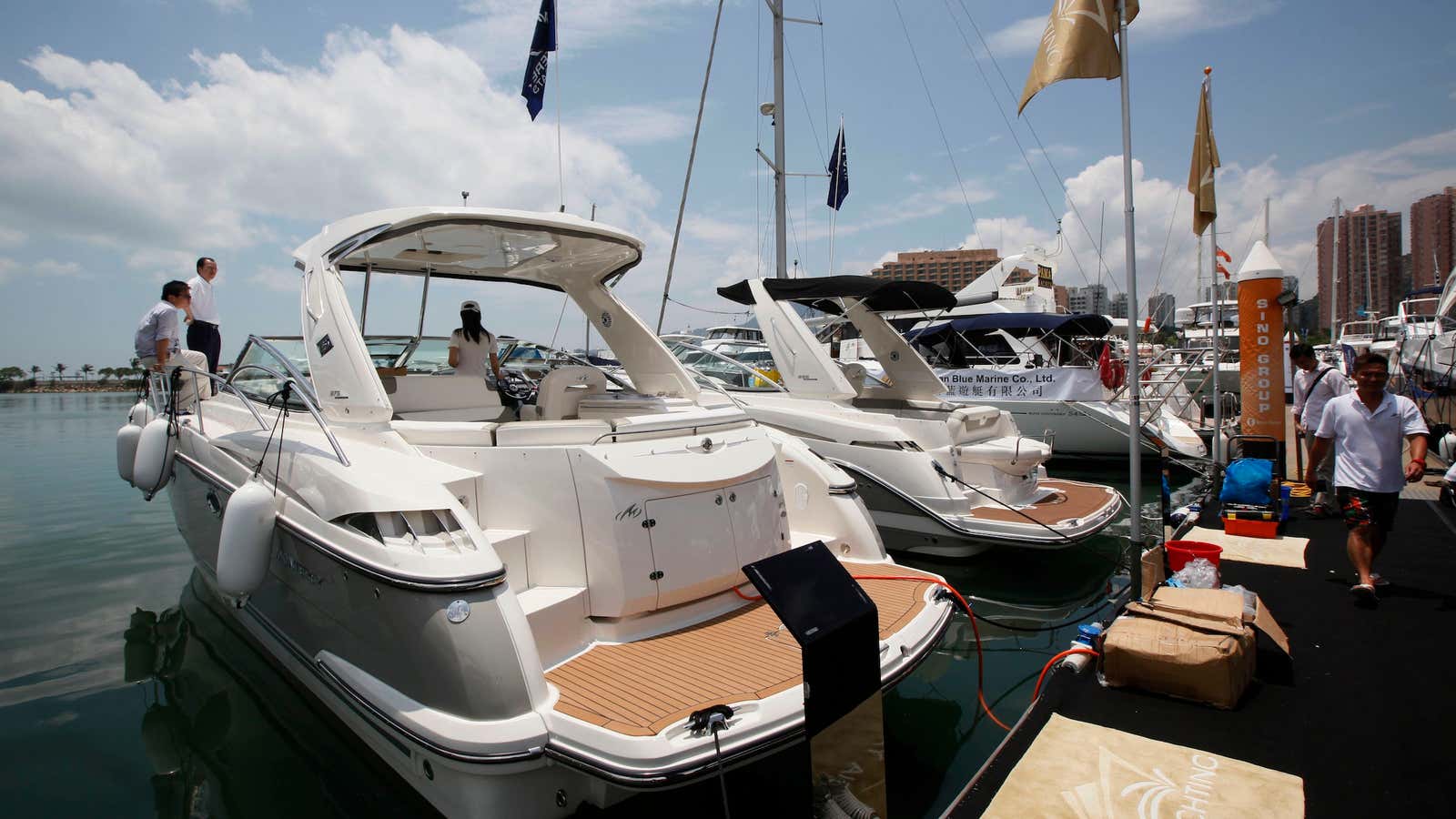 Yachts lined up at a Hong Kong boat show that might now be getting harder to sell.