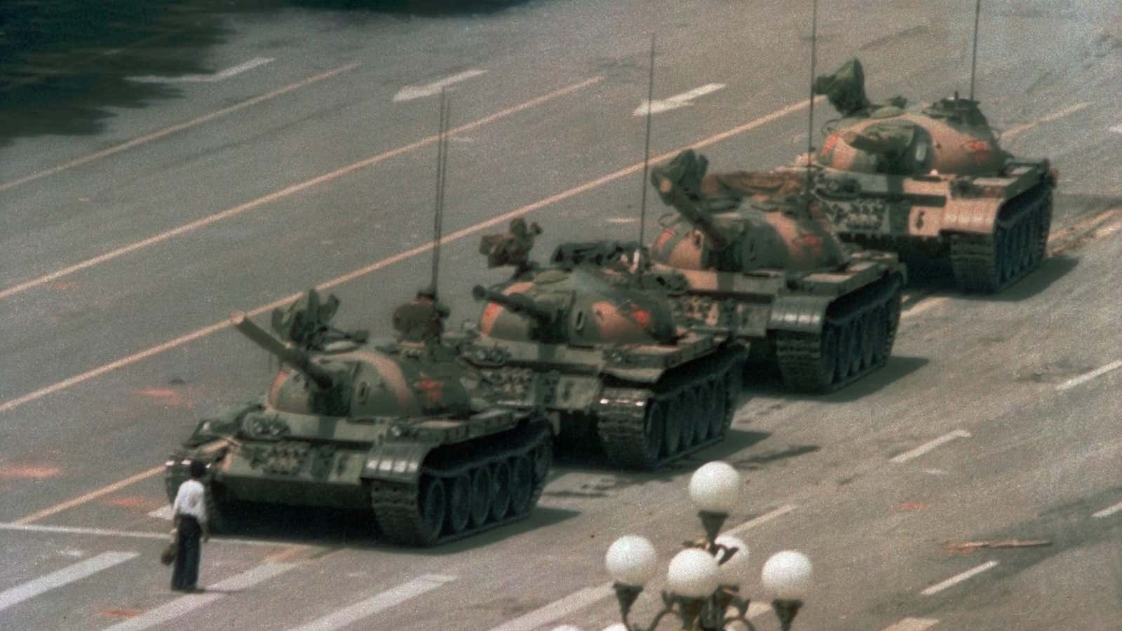 A Chinese man stands alone to block a line of tanks heading east on Beijing’s Cangan Blvd. in Tiananmen Square on June 5, 1989.