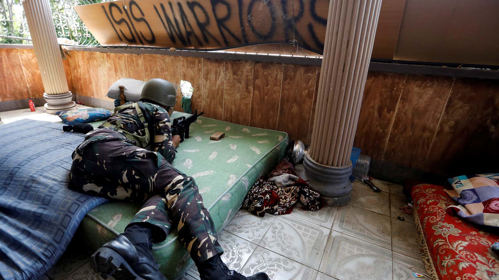 A Filipino soldier in combat position in July in Marawi city, where government troops have been battling insurgents.