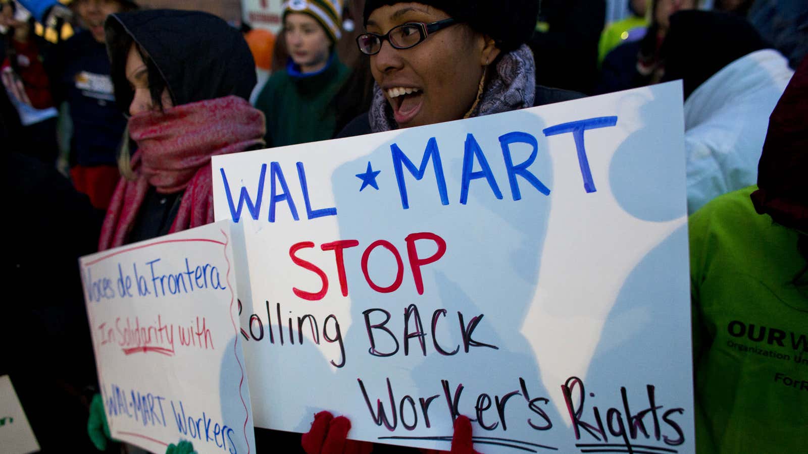 Workers and supporters march outside a local Wal-Mart retail store on Black Friday in Milwaukee, Wisconsin.