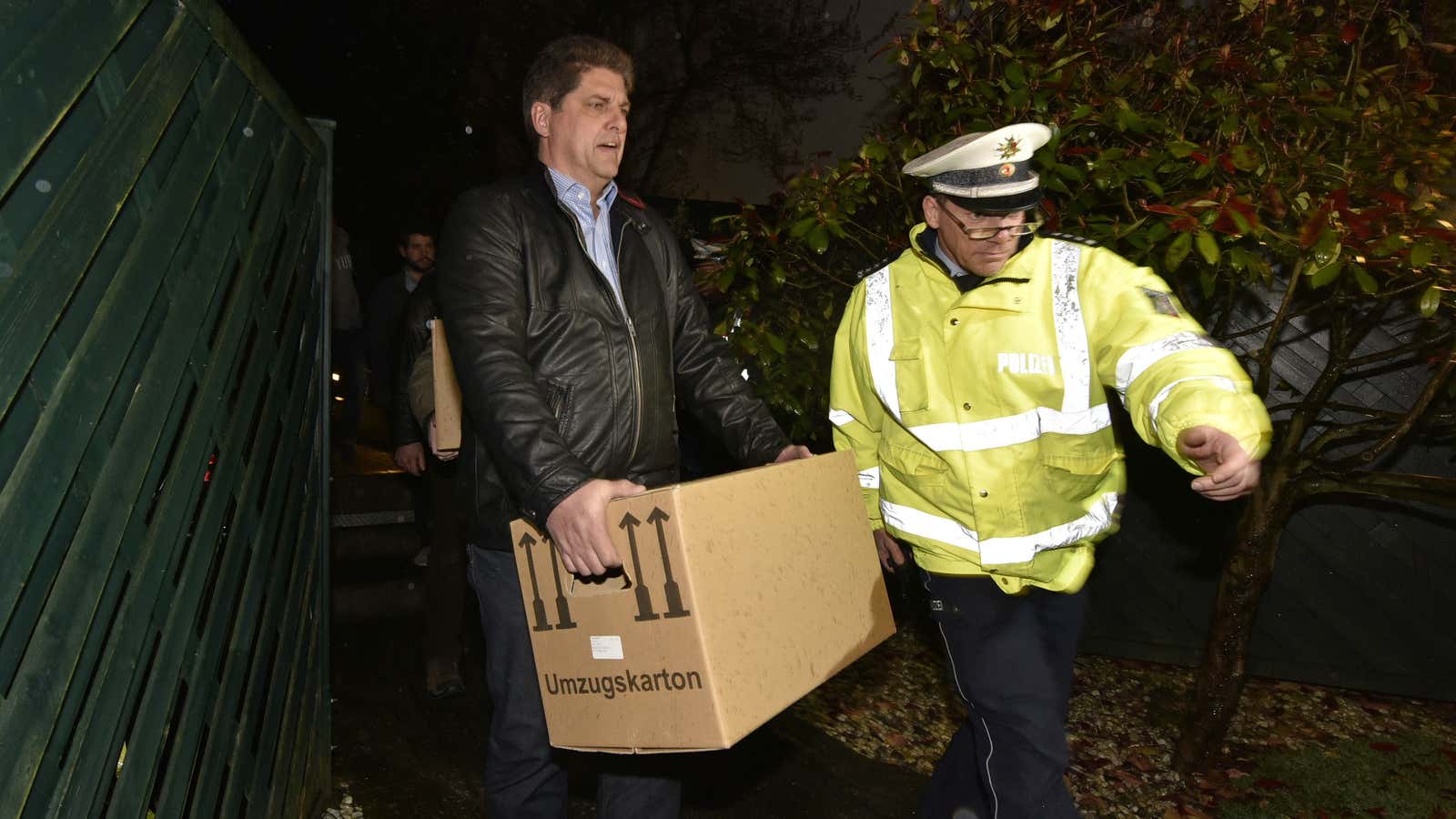 Investigators take boxes from the apartment of co-pilot Andreas Lubitz.