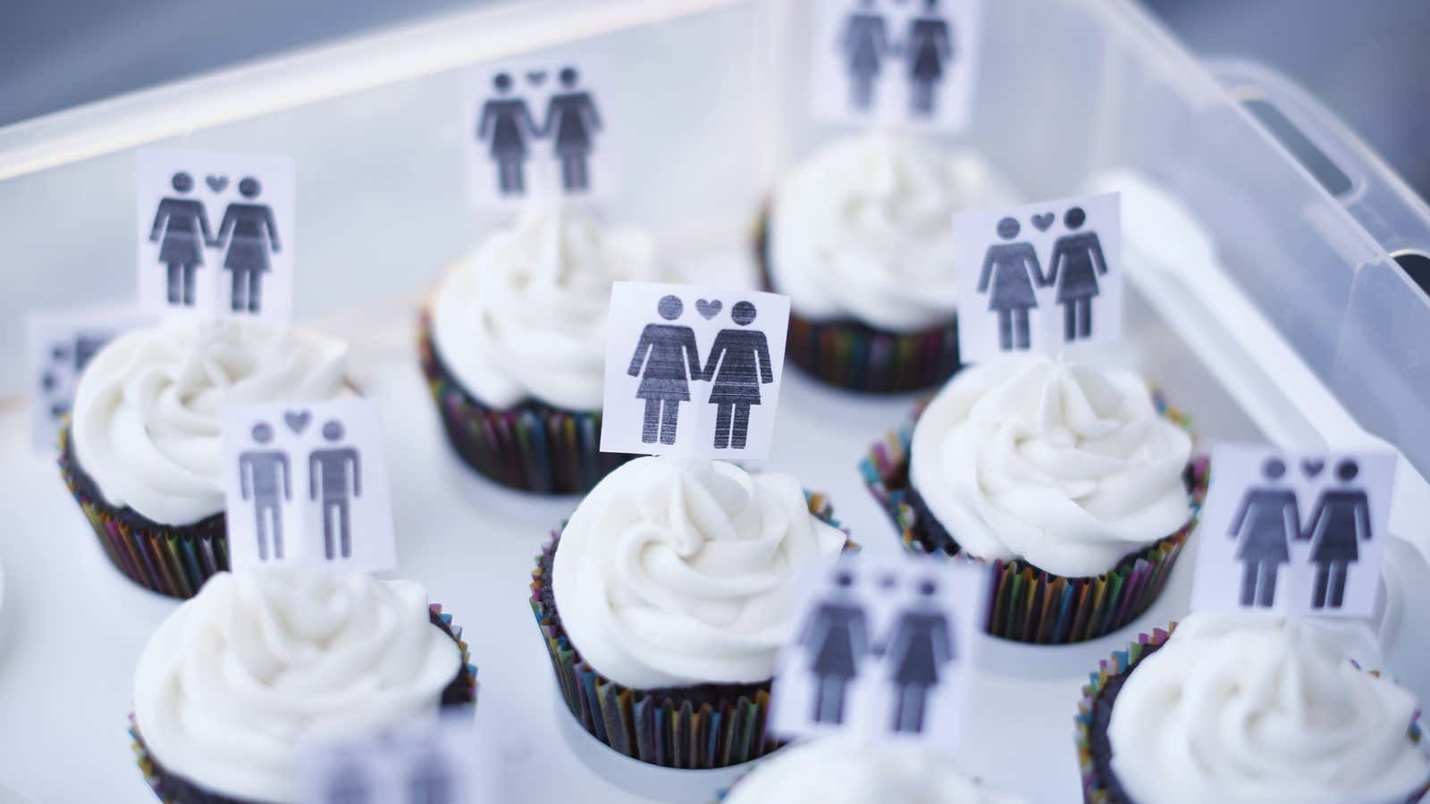 A box of cupcakes are seen topped with icons of same-sex couples at City Hall in San Francisco, June 29, 2013. Same-sex couples rushed to…