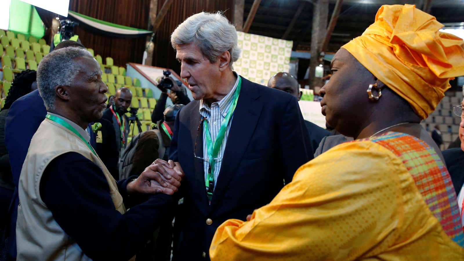 Former US secretary of State John Kerry and former South Africa President Thabo Mbeki, observers for the general election in Kenya, greet each other next to former Senegalese prime minister Aminata Toure in a tally centre in Nairobi, Kenya Aug. 9, 2017.