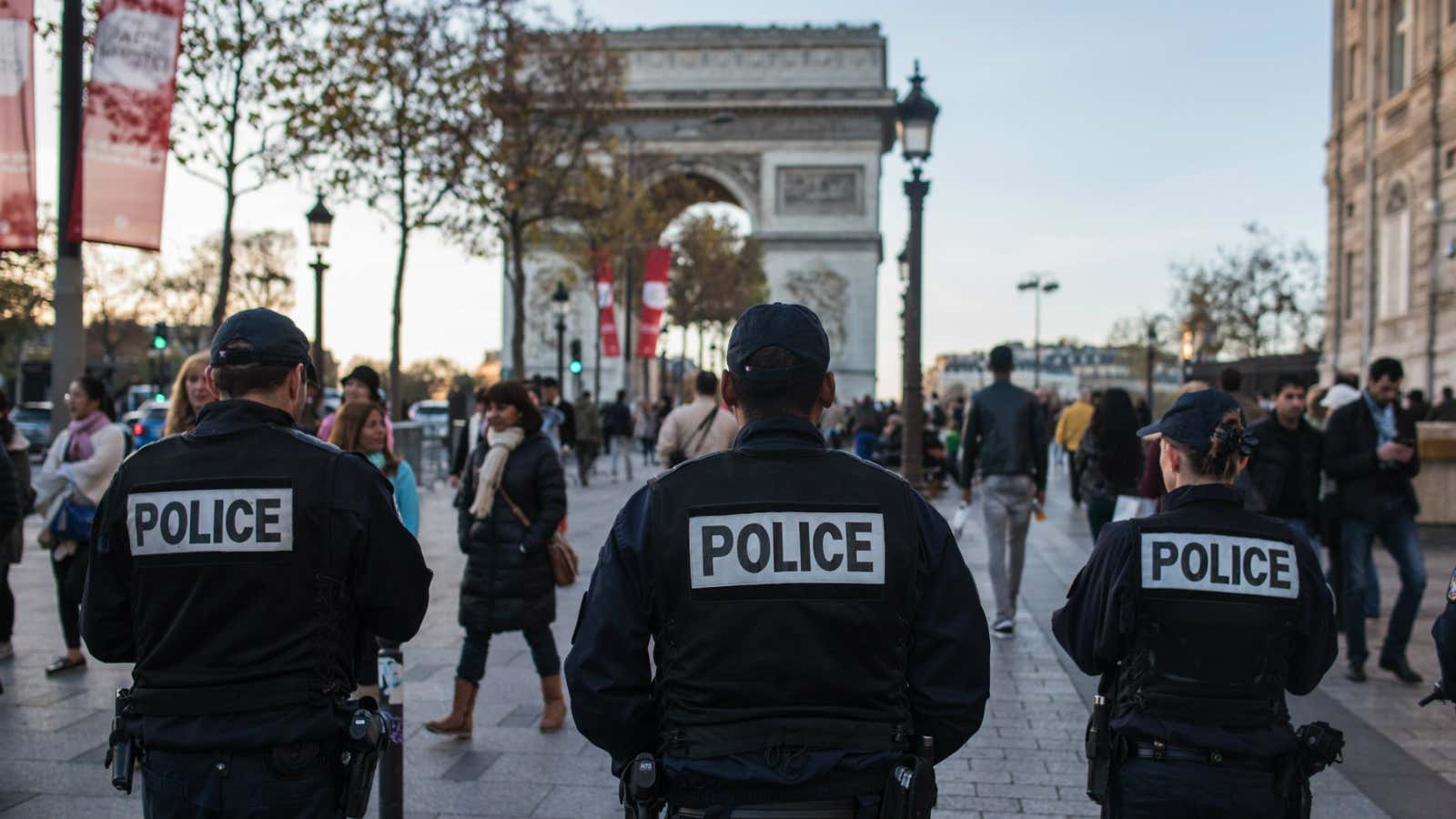 French police officers patrol on the Champs Elysees in Paris.