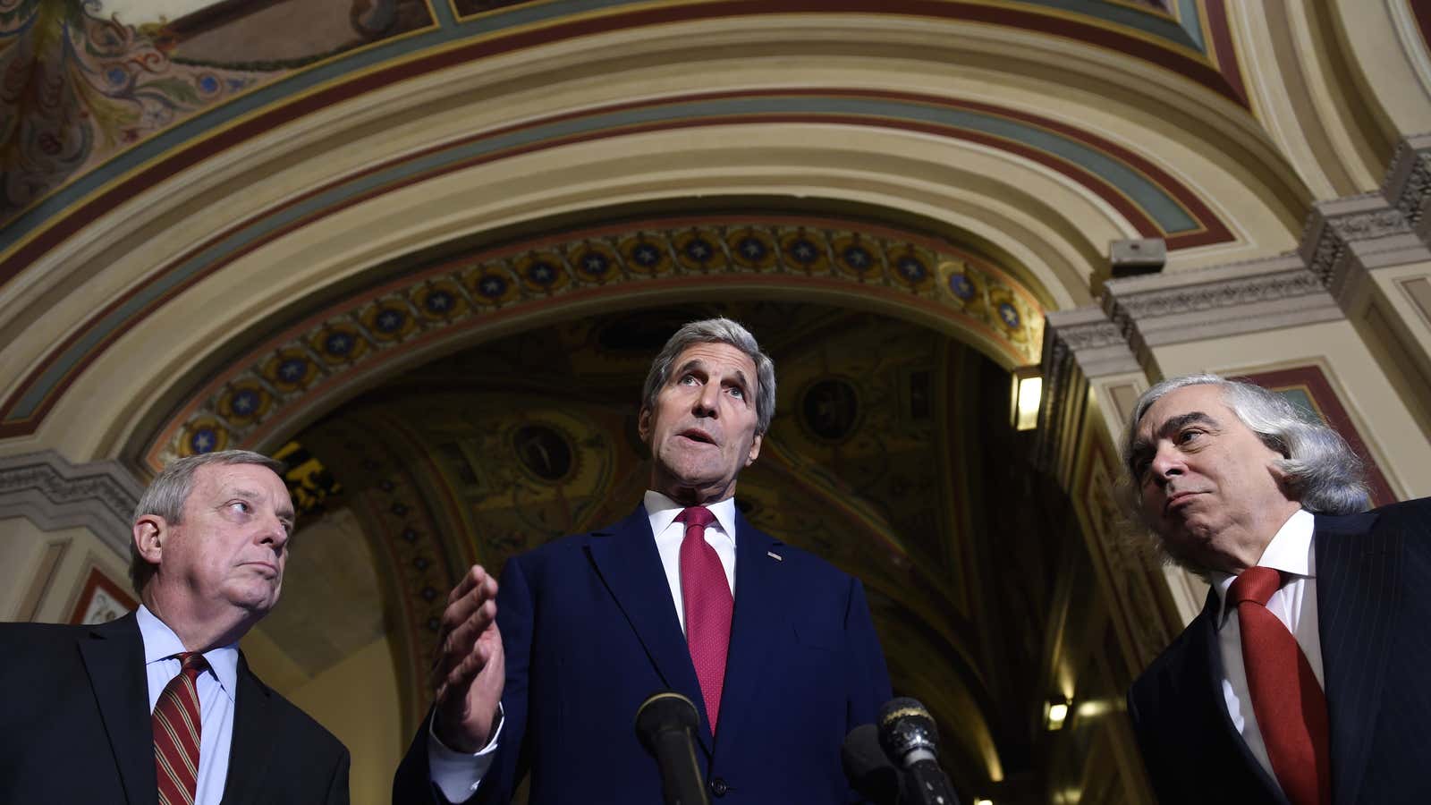 US secretary of state John Kerry, center, flanked by senator Richard Durbin of Illinois, left, and energy secretary Ernest Moniz, right, speaks to reporters following their meeting on Capitol Hill in Washington, Wednesday, Sep. 9, 2015, on the Iran nuclear deal.