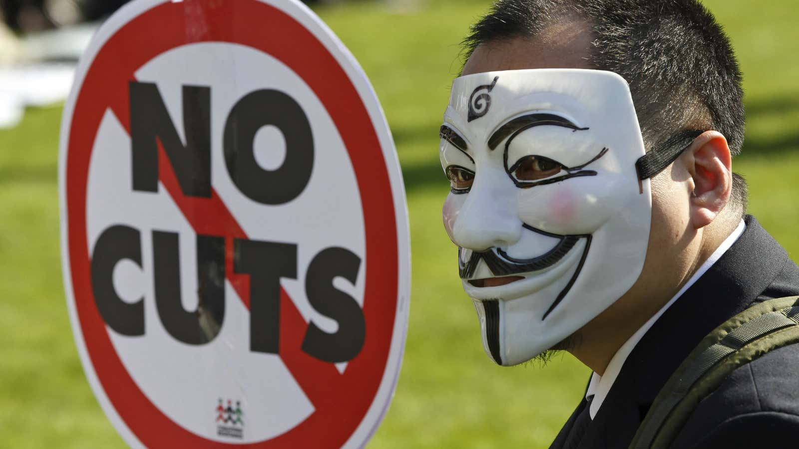 Anti-austerity protestor outside the UK Parliament