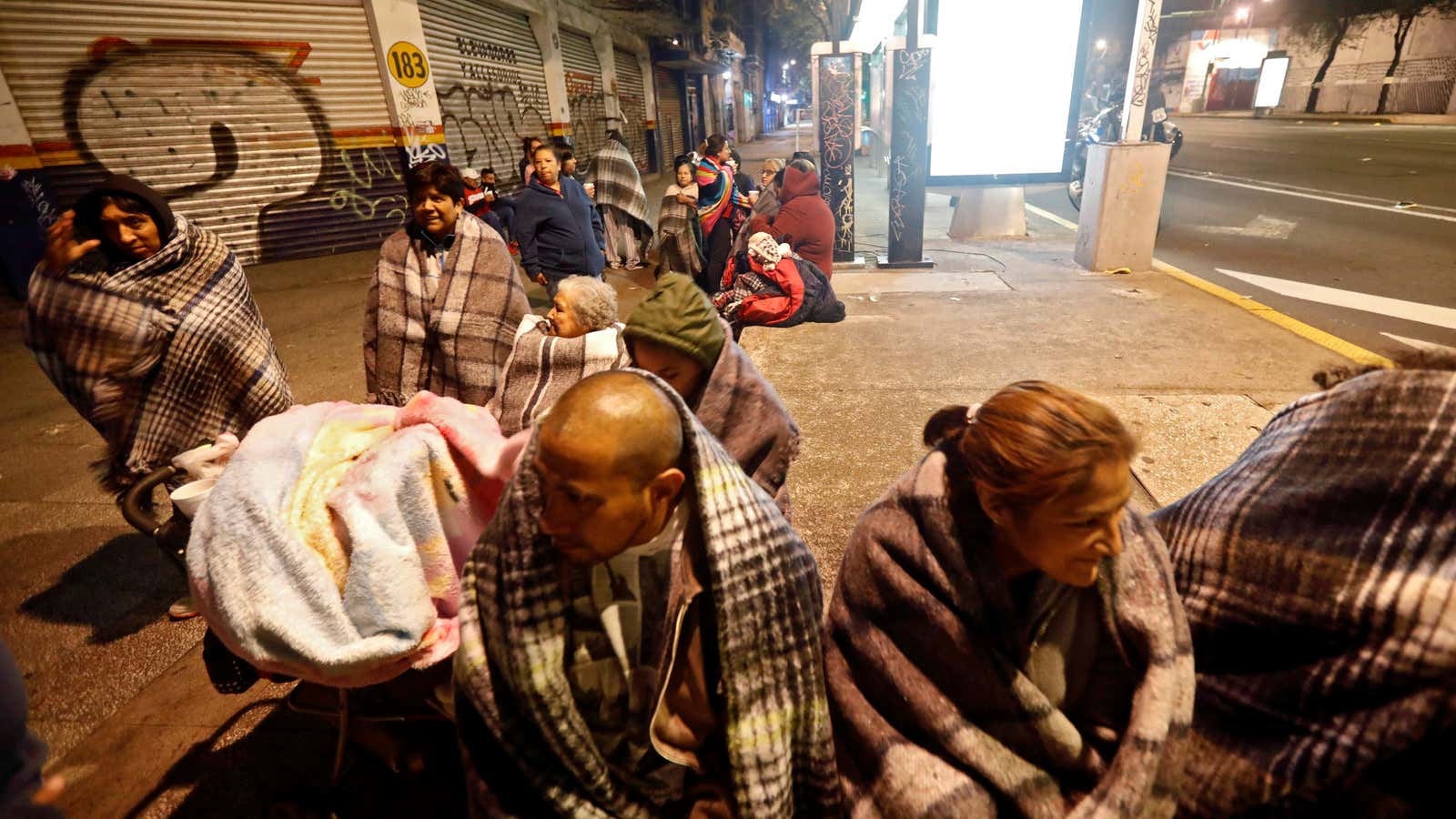 People gather on a street in Mexico City after a powerful earthquake hit the south of the country on  Sept. 8, 2017.