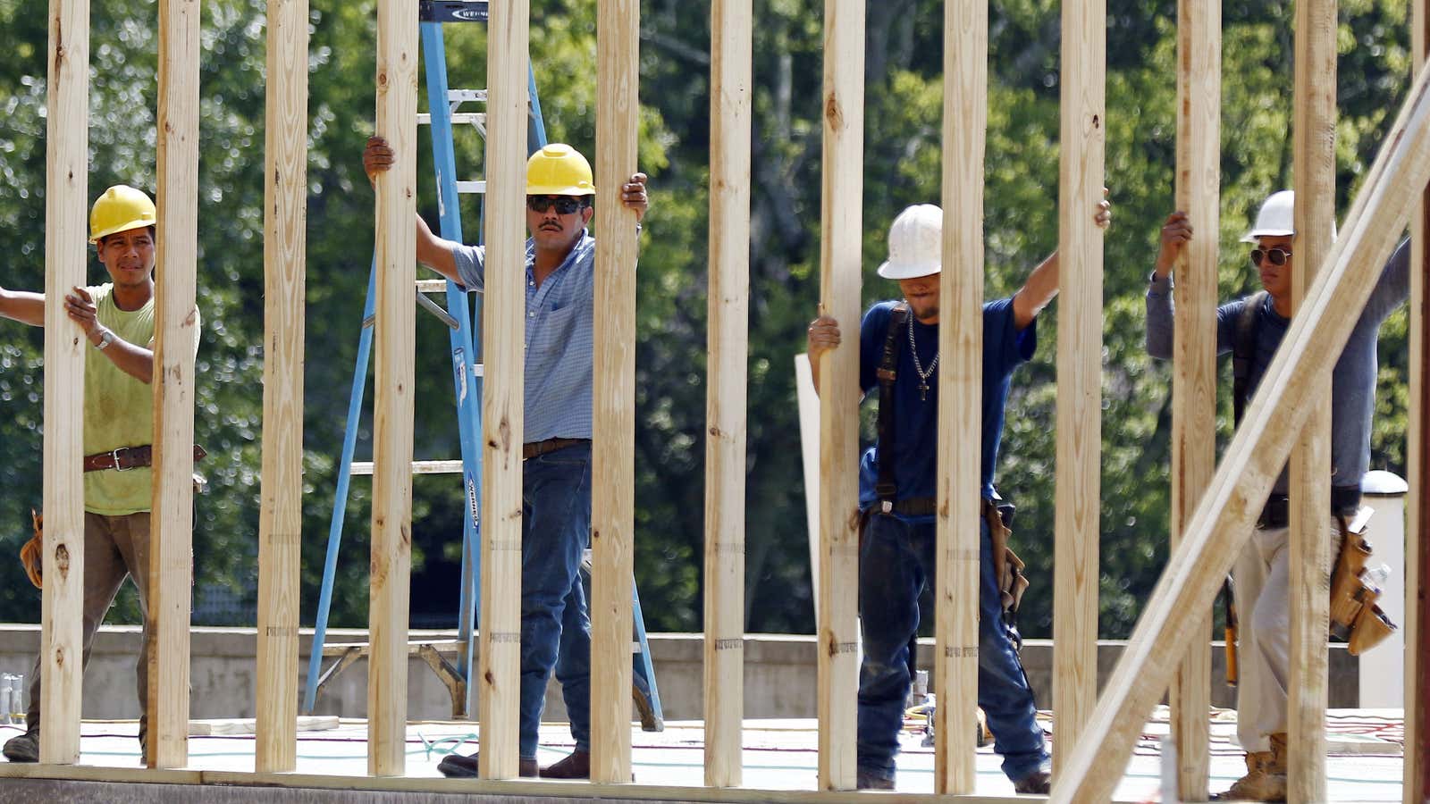 In this Aug. 21, 2017, photograph, construction workers set up a frame for what will eventually become a jewelry store, in Jackson, Miss. On Wednesday,…