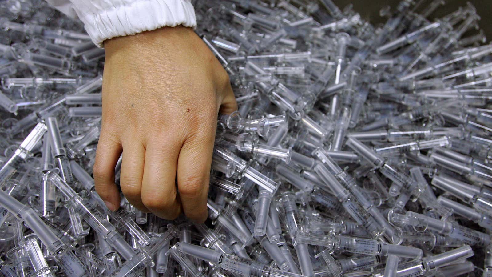 A Chinese worker arranges Hepatitis-A vaccines for packing.