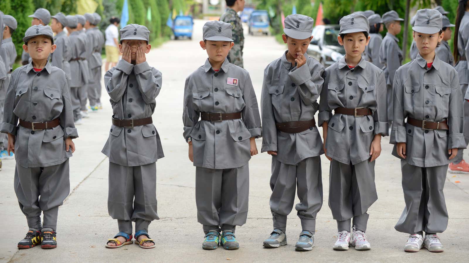 Starting early, primary school students take part in military formation camp.