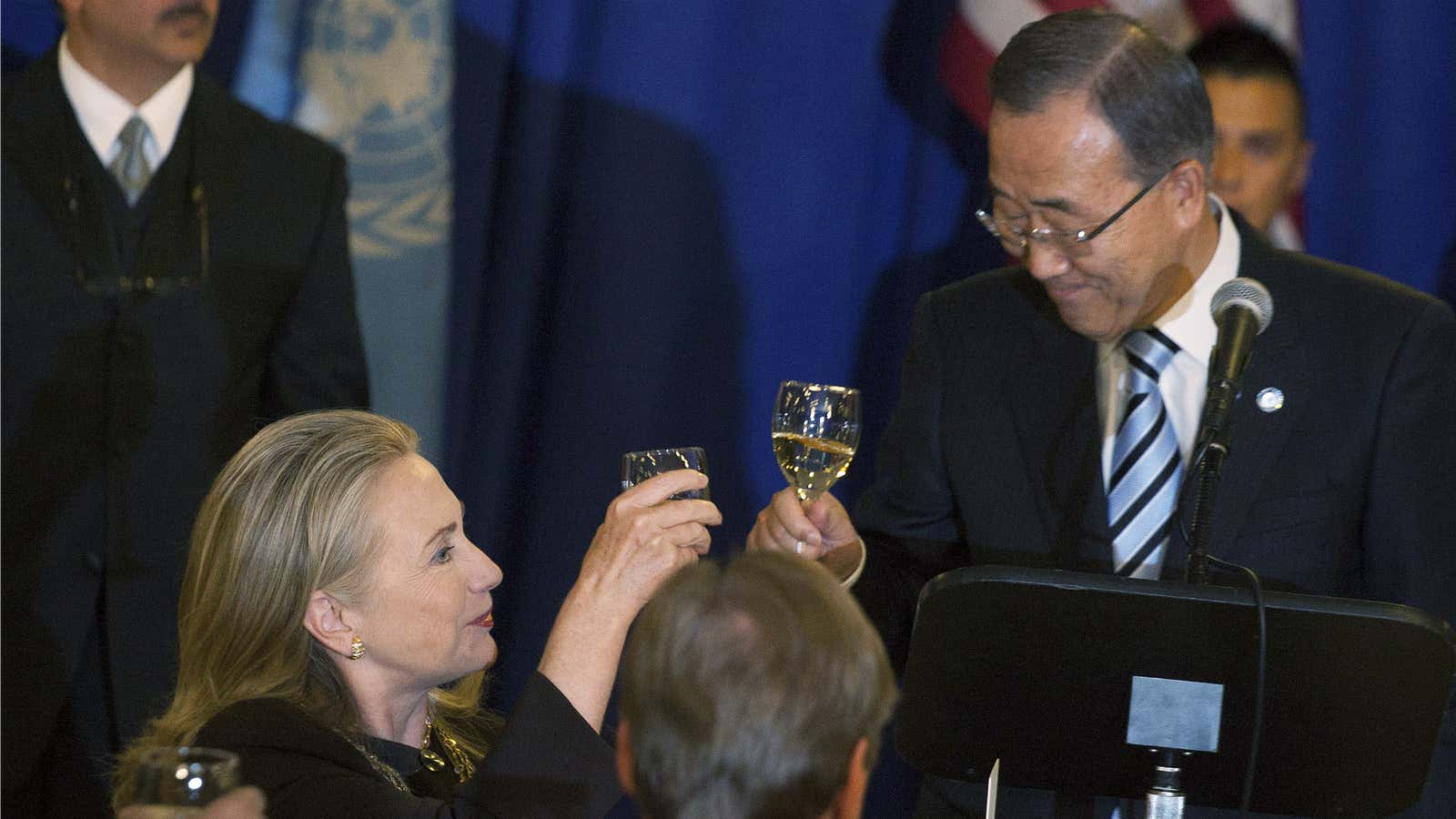 Hillary Clinton raises her glass to anything but the fact that Ban Ki Moon is the UN’s 8th consecutive male Secretary General.