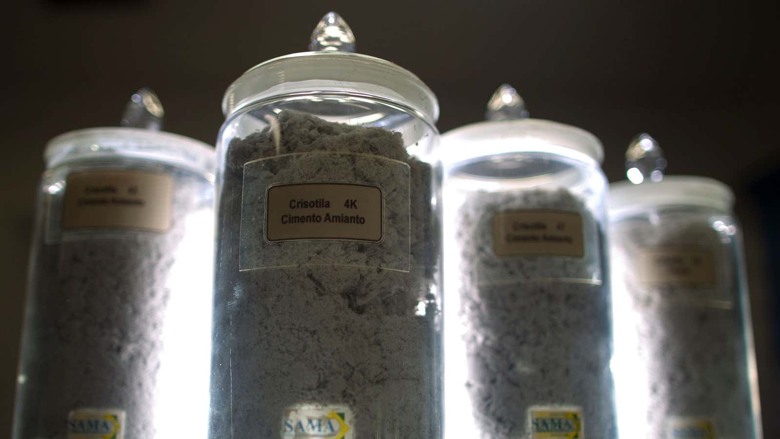 Jars containing different mixes of chrysotile, or white asbestos, sit on exhibit in the administrative office of the Cana Brava mine, owned and operated by SAMA S.A., part of the Brazilian Eternit Group, in Minacu, northern Goias State, January 17, 2013. Cana Brava is the only mine producing chrysotile in Latin America. Picture taken January 17, 2013. REUTERS/Ueslei Marcelino (BRAZIL – Tags: BUSINESS COMMODITIES ENVIRONMENT) – GM1E922054M01