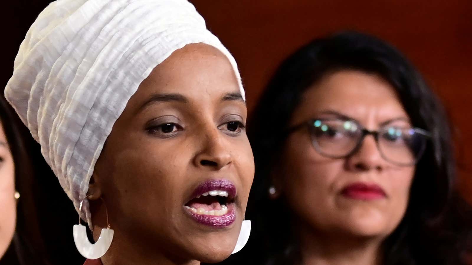 Reps. Ilhan Omar and Rashida Tlaib at a news conference.