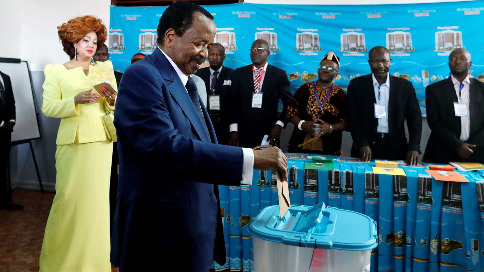 Cameroonian president Paul Biya casts his ballot while his wife Chantal watches during the presidential election in Yaounde, Cameroon Oct. 7, 2018.