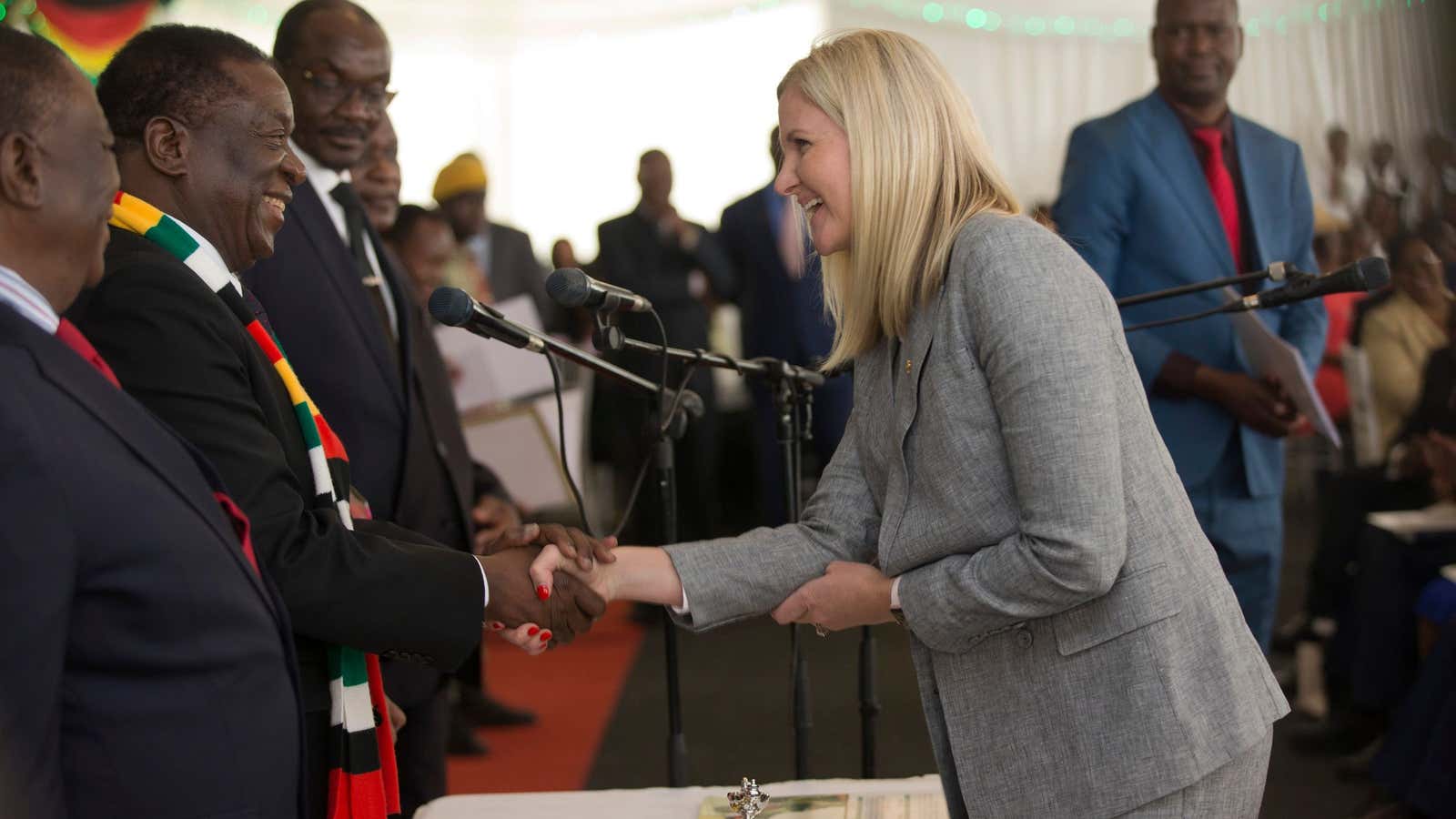 Zimbabwe’s president Emmerson Mnangagwa, left, congratulates Kirsty Coventry after she was sworn in as Zimbabwe’s sports minister