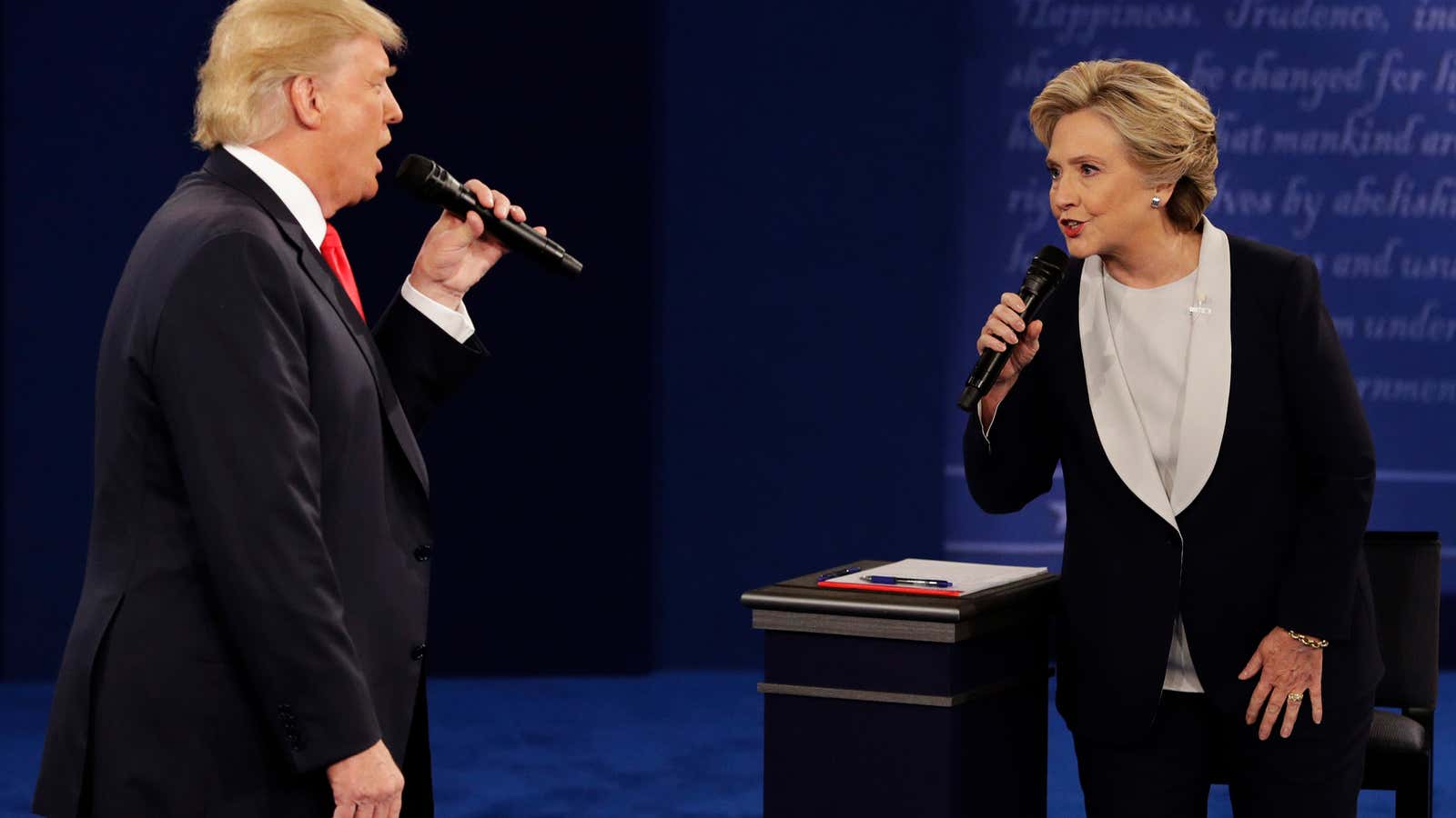 Republican presidential nominee Donald Trump and Democratic presidential nominee Hillary Clinton speak during the second presidential debate at Washington University in St. Louis, Sunday, Oct. 9, 2016. (AP Photo/John Locher)