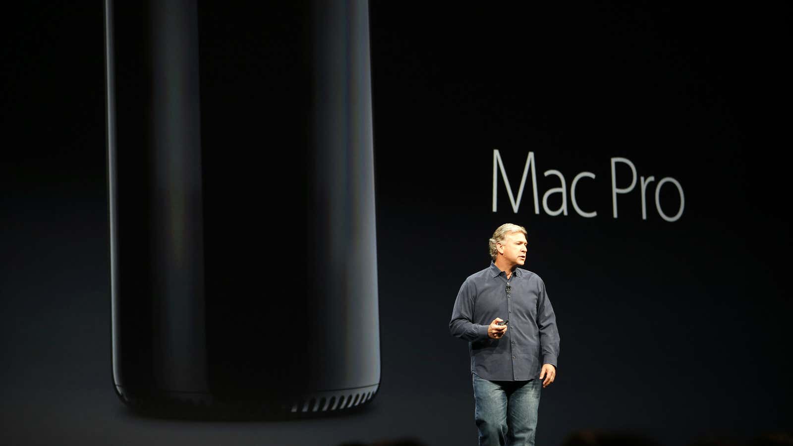 Phil Schiller, senior vice president of worldwide marketing at Apple Inc., introduces the new Mac Pro during Apple Worldwide Developers Conference (WWDC) 2013 in San…