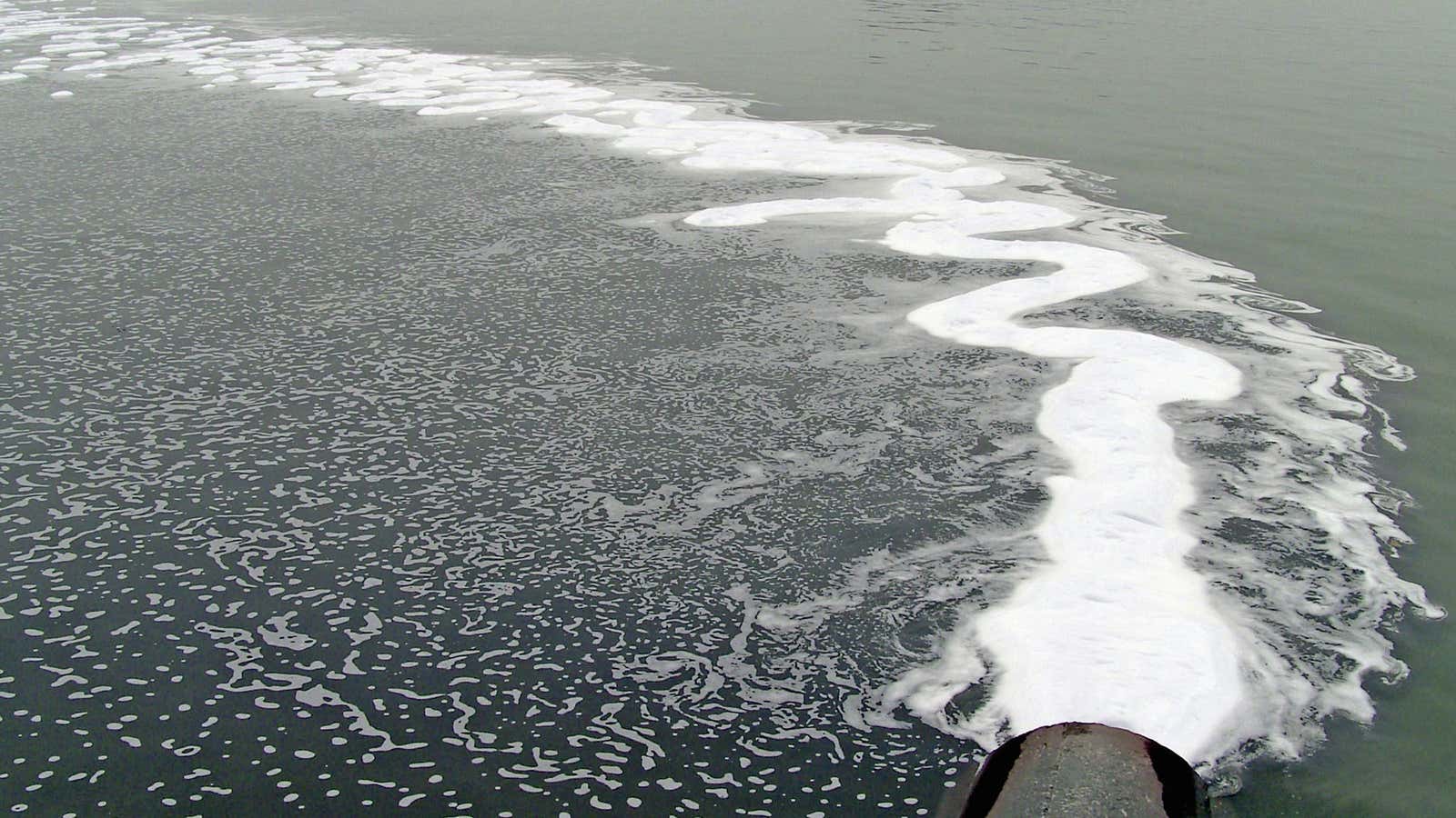 Industrial waste from a Chinese textile dyeing factory flows into a river.